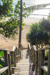 A wooden stairway to the sea. Afternoon beach bright at Nai Thon Beach Phuket Thailand