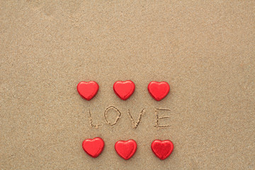 Chocolate color Lovely red heart on the beach. Background is a natural in real place, creative Valentine's Day Concept, tropical style background made in Phuket, Thailand.