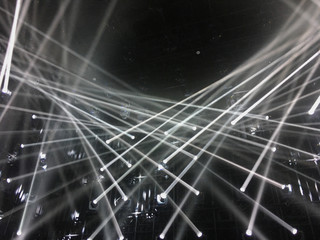 Blur white light beam in black background.