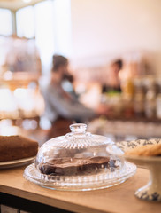 In a grocery store, close-up on the cakes on the counter 