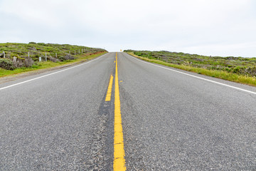 detail of cabrillo highway with yellow median stripe in California