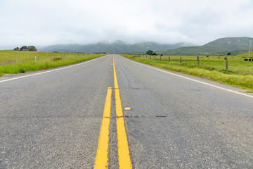 detail of cabrillo highway with yellow median stripe in California