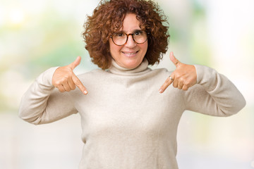 Beautiful middle ager senior woman wearing turtleneck sweater and glasses over isolated background...