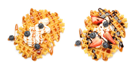 Set of delicious waffles with different toppings on white background, top view
