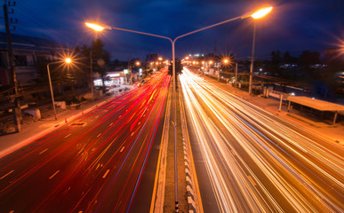 Fototapeta na wymiar Speed Traffic - light trails on The city road to Town Phuket Thailand highway at night, long exposure abstract background