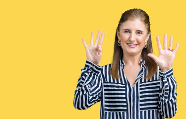 Middle age mature business woman over isolated background showing and pointing up with fingers...