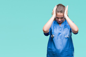 Young brunette doctor girl wearing nurse or surgeon uniform over isolated background suffering from...