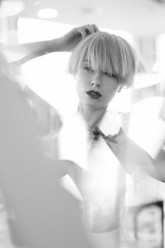 portrait of a beautiful young woman in the mirror, reflection, beautiful reflexes, glare, concept: multiarm