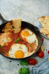 Homemade Shakshouka - Eggs poached in spicy tomato sauce