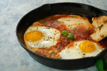 Homemade Shakshouka - Eggs poached in spicy tomato sauce