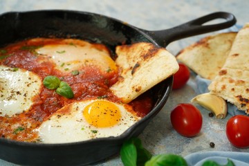 Homemade Shakshouka - Eggs poached in spicy tomato sauce