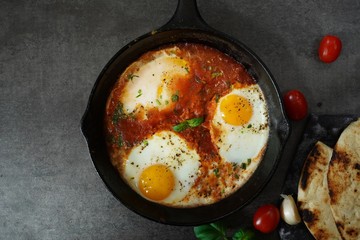 Homemade Shakshouka - Eggs poached in spicy tomato sauce
