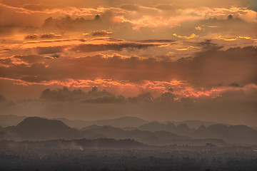 Wonderful landscape sunset, Clouds are layers that have different colors at sunset with mountains and fog-Image