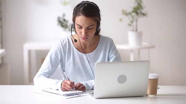 Young woman wearing headset learn foreign language using online course