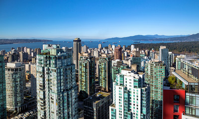  Aerial view at Downtown of Vancouver and  Vancouver Harbor and the Coastal Mountains in the background