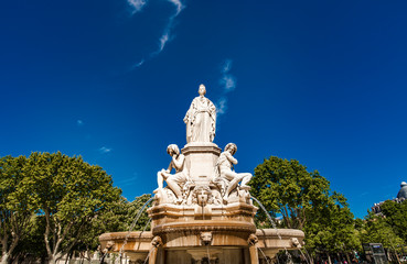 Fototapeta na wymiar Pradier fountain at Esplanade Charles-de-Gaulle in Nimes, France