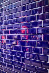 Reflection of the London phone booth in tile mosaic