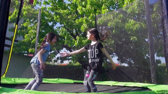 Kids jumping on trampoline, slow motion - 02