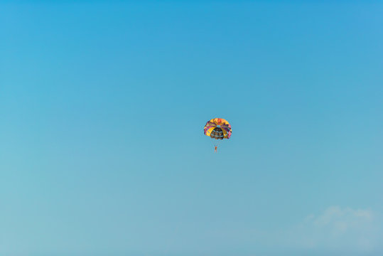 Flight on a parachute behind a boat on lake Issyk Kul. Extreme form of recreation. Rest in Kyrgyzstan.