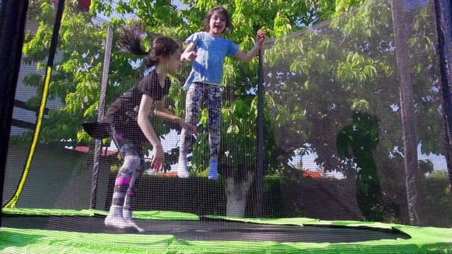 Kids jumping on trampoline, slow motion - 01