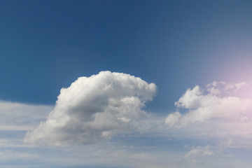 Colorful volumetric clouds on a bright sky.
