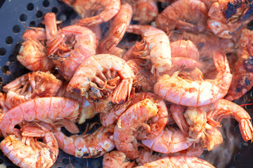 Cooking seafood shrimp prawn on the stove.