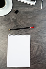 Business objects on a wood desk.