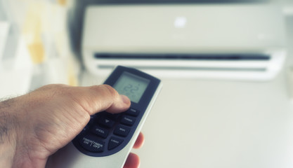 Hand hold remote control directed on the air conditioner