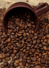 Coffee cup and coffee beans. Can be used as a background.