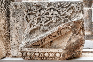 details of the decor of the ancient synagogue ruins in the city of Capernaum, the birthplace of St....