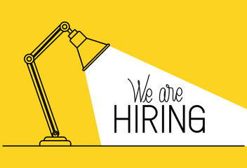 lamp desk with we are hiring message