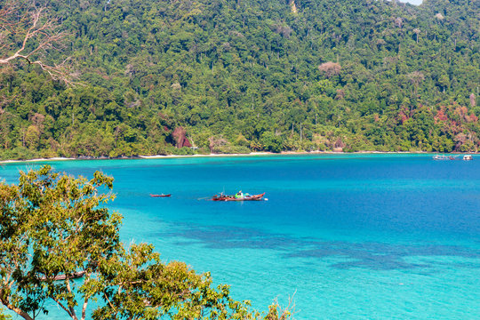 Aerial drone view of a beautiful tropical island surrounded by coral reef (Greater Swinton Island, Myanmar)