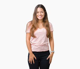 Young beautiful brunette woman wearing pink t-shirt over isolated background with a happy and cool smile on face. Lucky person.