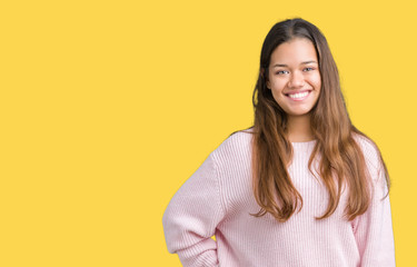 Fototapeta premium Young beautiful brunette woman wearing pink winter sweater over isolated background with a happy and cool smile on face. Lucky person.