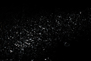 Fototapeta na wymiar Splash of water. Isolate on black background