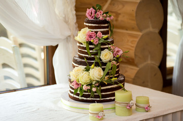White wedding cake with flowers. Wedding decoration.