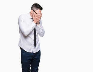 Young handsome business man wearing glasses over isolated background with sad expression covering face with hands while crying. Depression concept.
