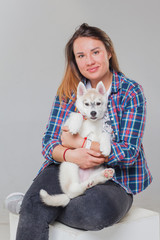 woman with puppy siberian husky