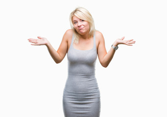 Fototapeta premium Young beautiful blonde woman over isolated background clueless and confused expression with arms and hands raised. Doubt concept.