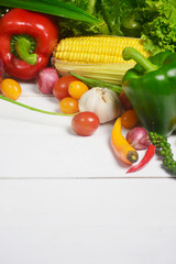 Raw organic vegetables on white wooden background, Healthy food.