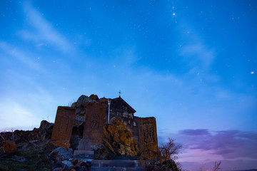 Fototapeta premium Old Armenian church at the sunrise. Hayravank Monastery, Armenia. 