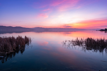 Beautiful sunrise on the lake. Colorful sky.