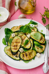 Grilled zucchini courgette with feta cheese and garlic
