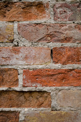 Red crumbling brick wall texture