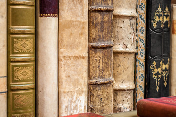 Old books stack. Old leather covered books.