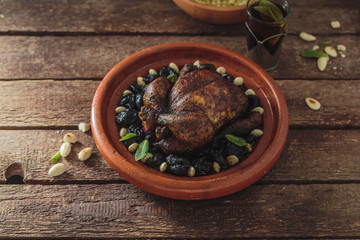 Whole chicken tajine, moroccan food, close view.