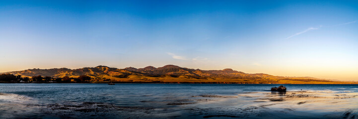 Sunset panorama at the beach and mountains
