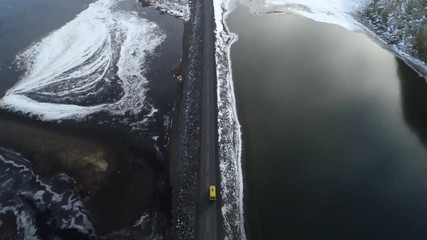 Aerial Tracking Yellow Van, Spectacular Coastal Road Route 1, Iceland.