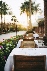 romantic dinner served table outdoor while sunset