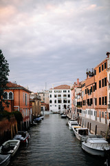 Fototapeta na wymiar canal in venice with lots of boats tied up